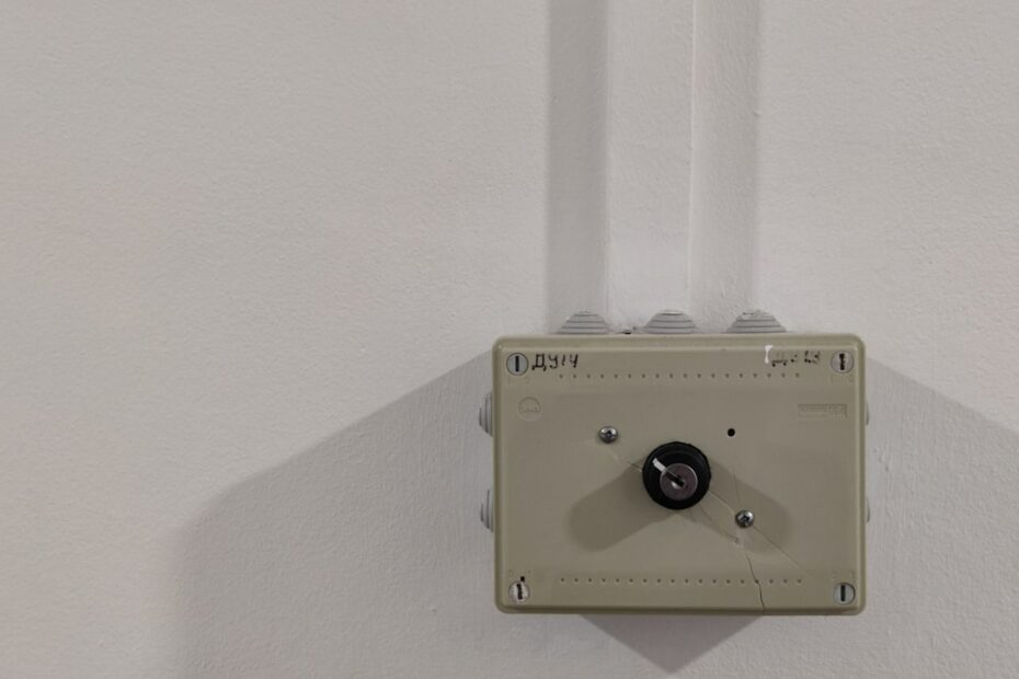 an electrical device mounted on a white wall